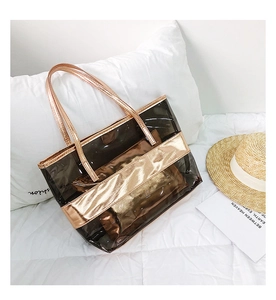 Detail of transparent PVC tote bag with rose gold trim and inner privacy pouch