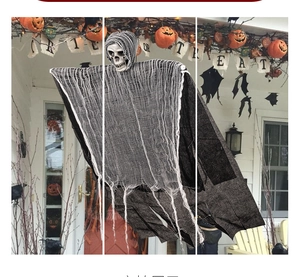 Close-up of hanging Halloween grim reaper ghost with tattered black gauze for yard decor