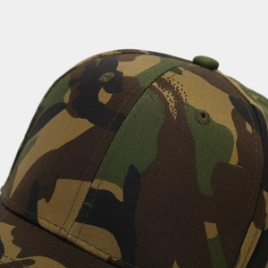 Close-up of camouflage baseball cap top with stitched eyelets and cotton twill texture