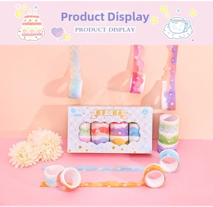Close-up of cute 12-roll washi tape set featuring clouds and floral patterns in blue gift box