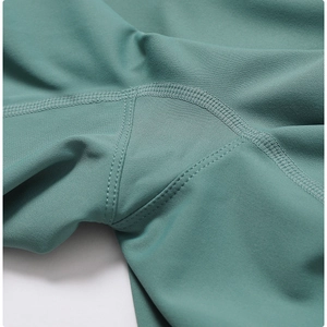 Detail of high-density knit yoga shorts showing durable flatlock seams and gusset crotch