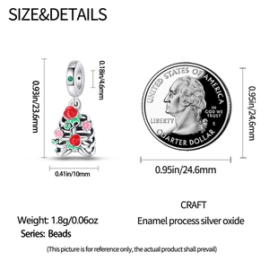 Size and details of silver rib cage charm with flowers compared to a quarter coin