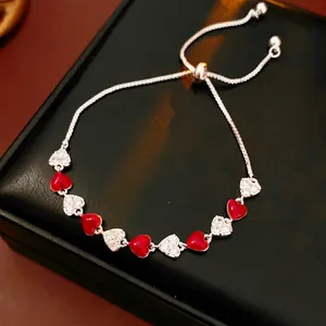 French vintage silver bracelet with alternating red and white zircon heart charms