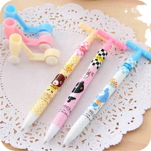 Creative scooter-shaped ballpoint pens with matching holders in pink, beige, and blue