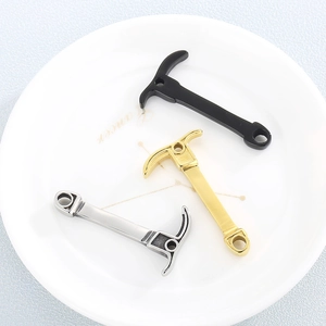 Three-piece stainless steel pickaxe pendants in black, gold, and silver finishes