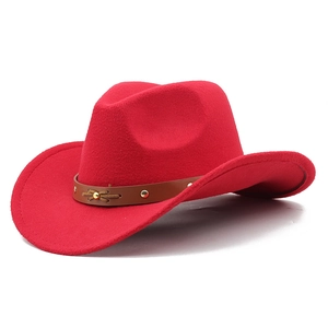 Close-up of red wool felt cowboy hat with brown leather band and gold stud accents