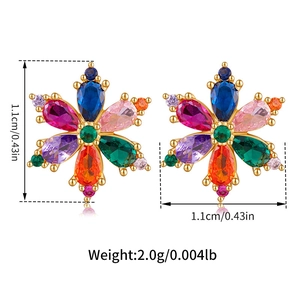 Macro detail of leaf studs featuring colorful zircons and 18K gold plated base