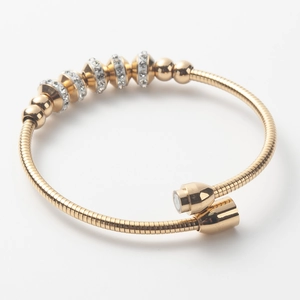 Elegant gold titanium steel bangle with sparkling zircon beads and spiral texture design