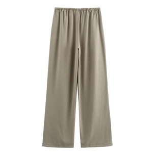 Detail view of khaki high-waisted wide-leg trousers with an elastic waistband and draped fabric
