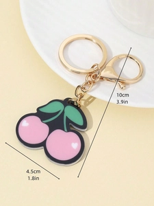 Detailed view of pink cherry keychain dimensions with gold metal ring and lobster clasp