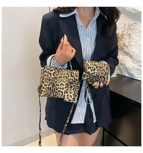 Close-up of leopard print handbag set including crossbody bag and coin purse details