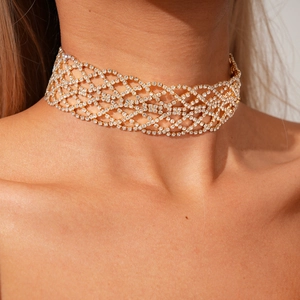 Close-up of luxury gold mesh choker with sparkling white rhinestones on model