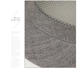 Close-up of gray breathable mesh and woven texture on a men's summer straw hat