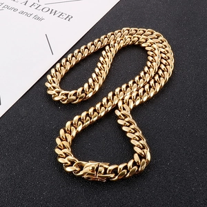 Close-up of golden Cuban link chain for men with high-polish finish and box clasp
