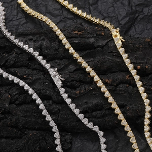 Iced out heart tennis necklaces in gold and silver finish with sparkling zircons
