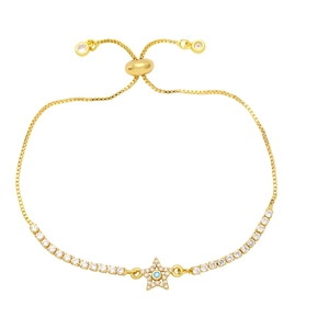 Adjustable gold star bracelet with pavé zircons and a blue center stone on white background