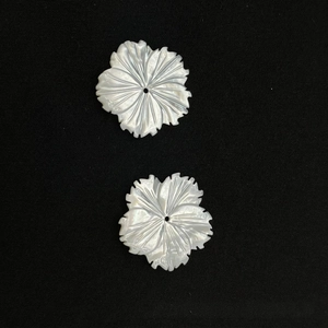 Detail of handcrafted white mother of pearl shell flower petals for DIY jewelry