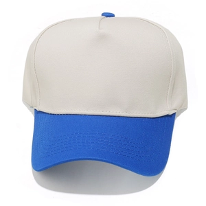 Detail of five-panel baseball cap showing blue visor with neat reinforced stitching