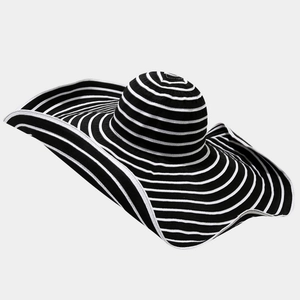 Detailed view of the wide wavy brim and high-contrast black and white stripes pattern