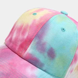 Detailed close-up of colorful tie-dye baseball cap with fine stitching and embroidery