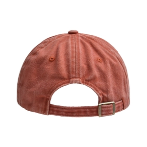 Detail view of the metal buckle adjustment on a vintage washed cotton baseball cap