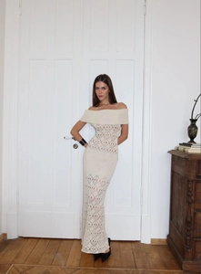 Detailed view of the off-shoulder crochet texture and diamond knit pattern on the dress