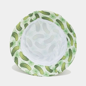 Detail of white bucket hat with green cucumber print showing breathable mesh lining inside