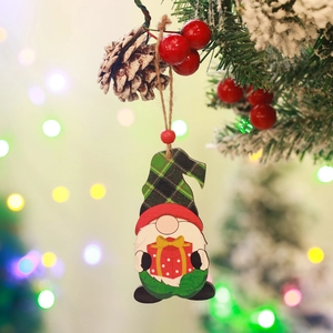 Detail of wooden Christmas gnome ornament with green plaid hat holding a red gift box