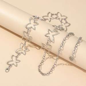 Close-up of silver hollow butterfly waist chain with rose pendant and lobster clasp