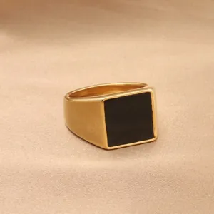 Vintage gold-plated stainless steel signet ring with a square black stone on silk