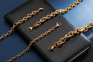 Detailed view of four assorted gold stainless steel O-chains with lobster clasps