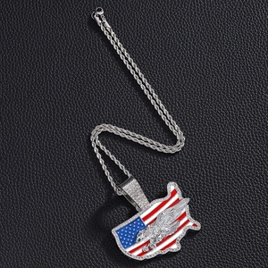 Detailed close-up of iced out USA map pendant with eagle on silver rope chain