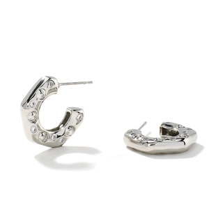 Silver C-shaped earrings with micro-inlaid cubic zirconia stones on a white background