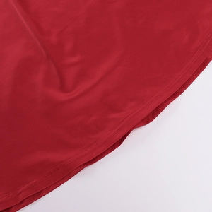 Close-up of the high-quality double stitching and smooth red satin fabric texture