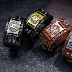 Handmade leather bracelets with Viking runes and bear paw metal charms in black and brown