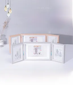 Detail of Nordic triple folding photo frame with wooden grain and flexible metal hinges