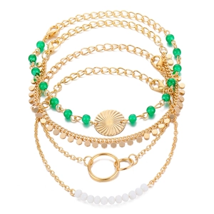 5-piece gold alloy chain bracelet set with green beads and sunburst pendant charm