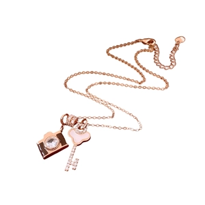 Adjustable rose gold necklace featuring a zircon camera and shell key pendant design