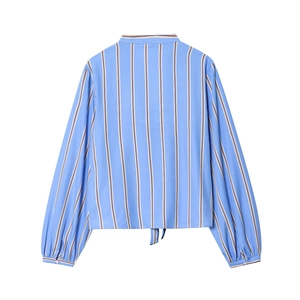 Detail of blue striped poplin shirt back with lantern sleeves and adjustable bow tie