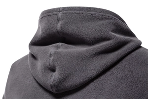 Detailed view of the dark grey polar fleece fabric and hoodie construction
