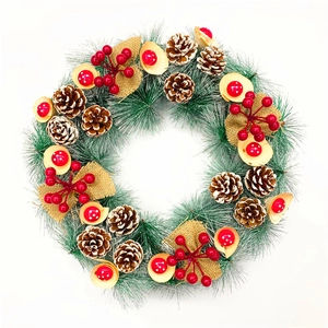 Christmas wreath with pine needles, pine cones, red berries and wood decor on white background