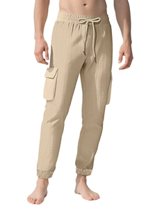 Detail of khaki cargo pants featuring drawstring waist, side pockets and plaid texture