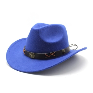 Close-up of deep blue felt cowboy hat featuring leather band with bronze bull head accents