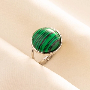 Detailed close-up of adjustable silver steel ring with green malachite stone inlay