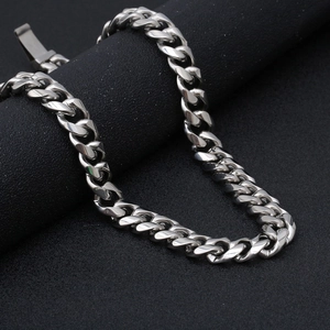 Close-up of polished silver Cuban link chain in durable stainless steel for men