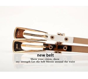 Detail of slim waist belts in white leather and leopard print with gold trapezoid buckles