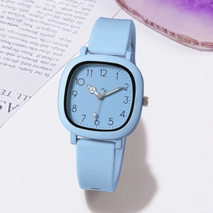 Detail view of a light blue square dial quartz watch with a silicone strap and numeric markers