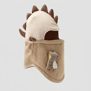 Detailed view of fleece dinosaur hood with adjustable drawstrings and soft 3D spikes