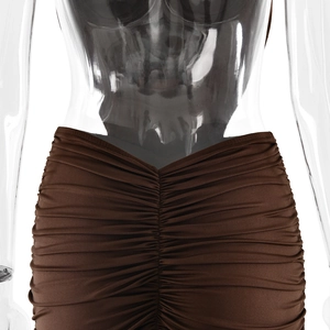 Detailed view of the ruched design and texture on a dark brown evening fishtail gown