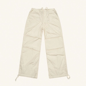 Off-white lightweight parachute wide-leg pants with adjustable drawstrings on a clean background